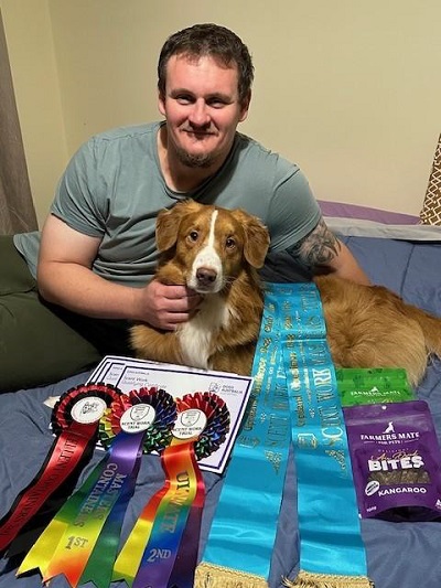 Levi with Aaron and his awards 